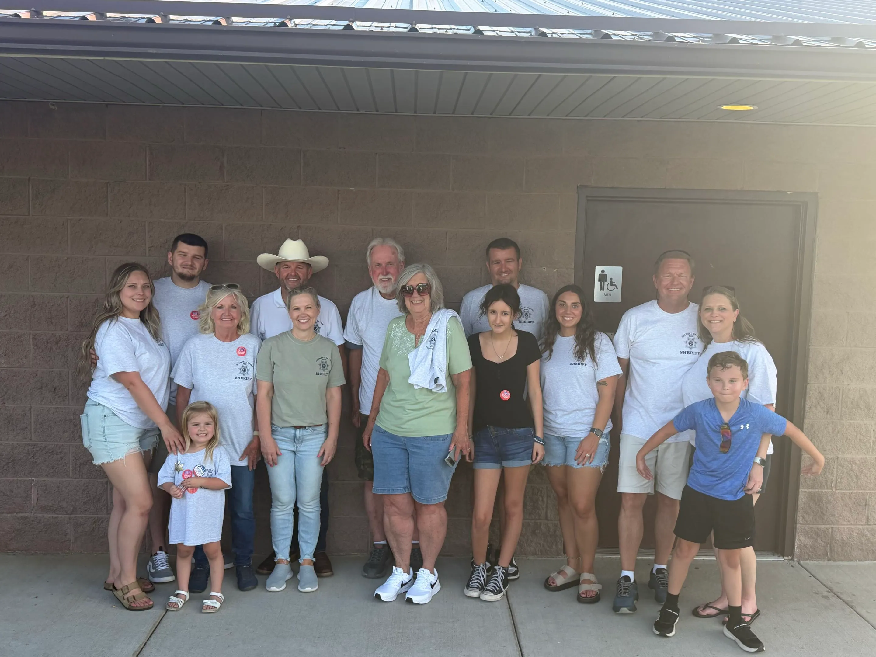 Family and supporters in Michael Cavins for Sheriff shirts at the Tazewell meet and greet