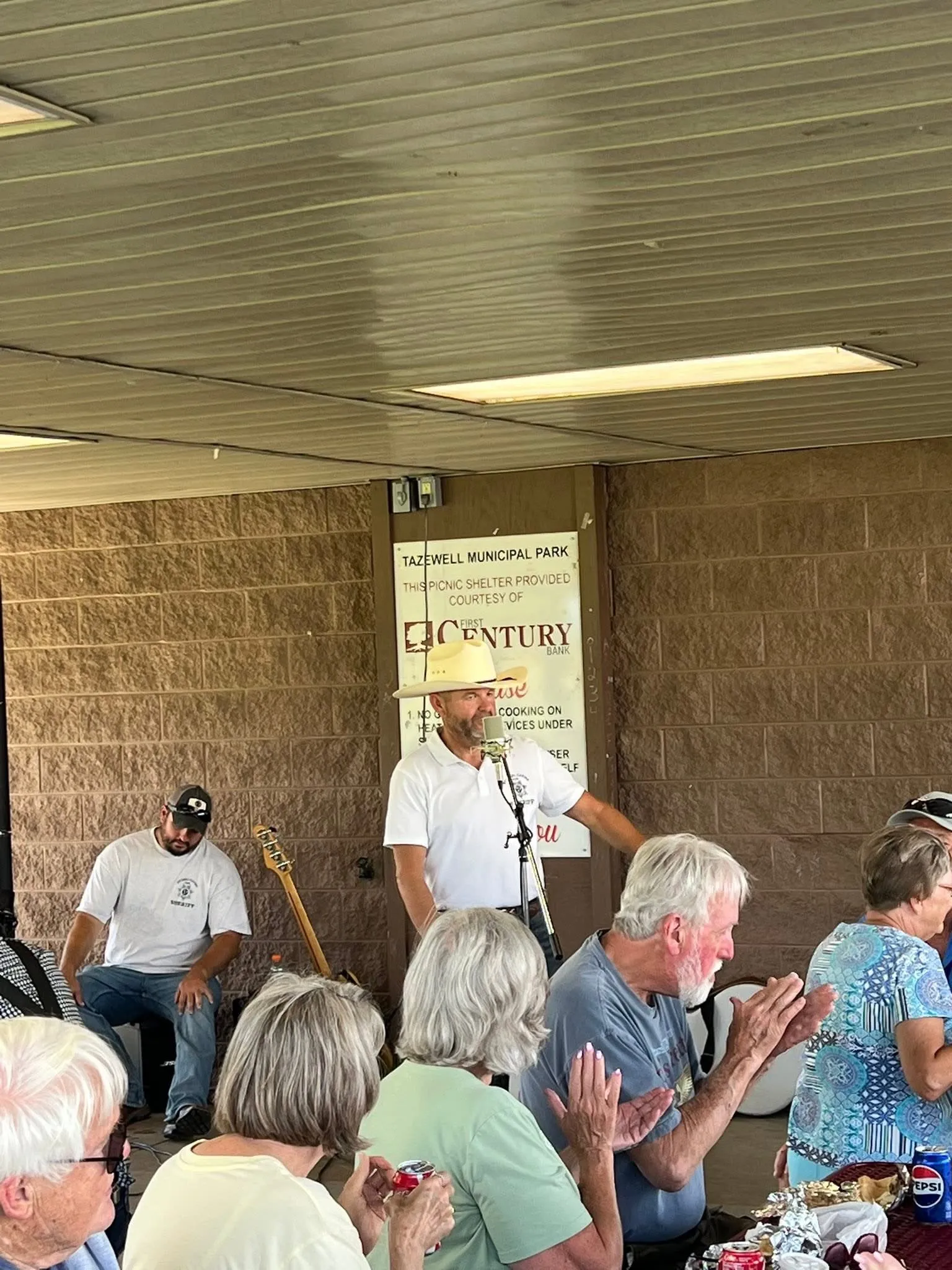 Michael Cavins speaking to a crowd of residents at the Tazewell Municipal Park picnic shelter